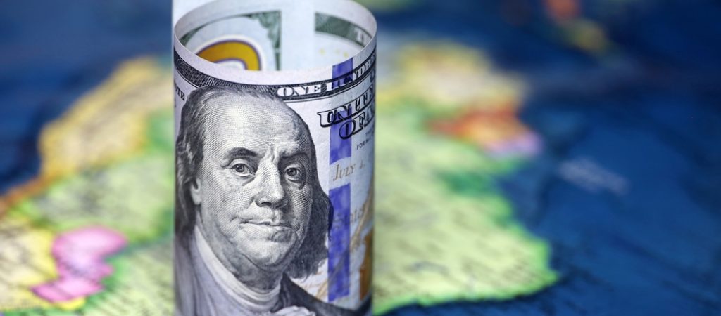 Us,Dollar,On,The,Map,Of,South,America.,American,Investment