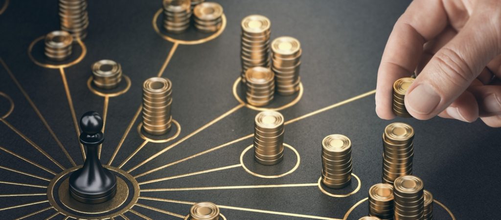 Man,Puting,Golden,Coins,On,A,Board,Representing,Multiple,Streams