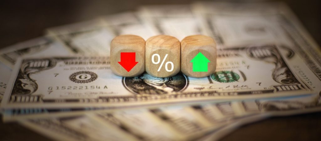 Dollar,Bills,And,Dice,Analyzing,Currency,Fluctuations,With,Red-green,Arrows