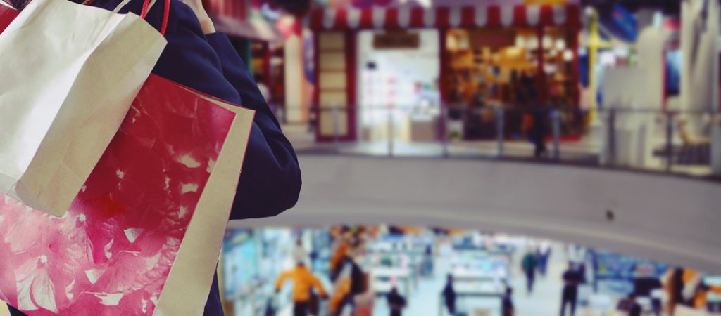 Woman,Holding,Shopping,Bags,In,The,Shopping,Mall