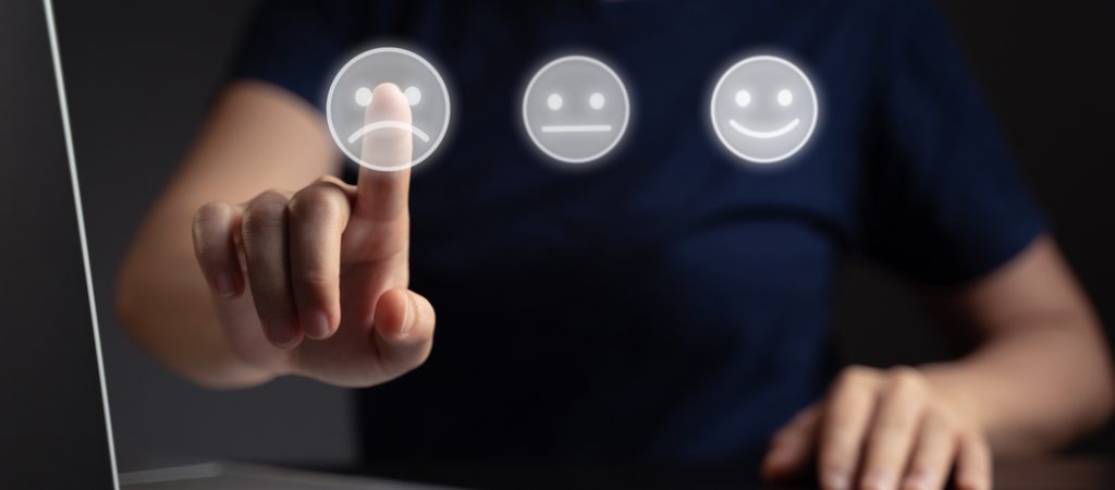 Feelings,Of,Woman,Using,Laptop,And,Emoticon,Hologram,Effect.